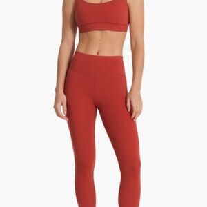 Vuori Stride Leggings Brick Red Size M Pants Side Pockets 7/8 length